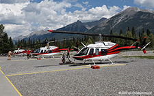 Bell 206L LongRanger | C-FSKR | untitled (Alpine Helicopters)  |  With a thunderstorm arriving, rotorblades need to be protected | CANMORE MUNICIPAL HELIPORT (----/---) 17.07.2023